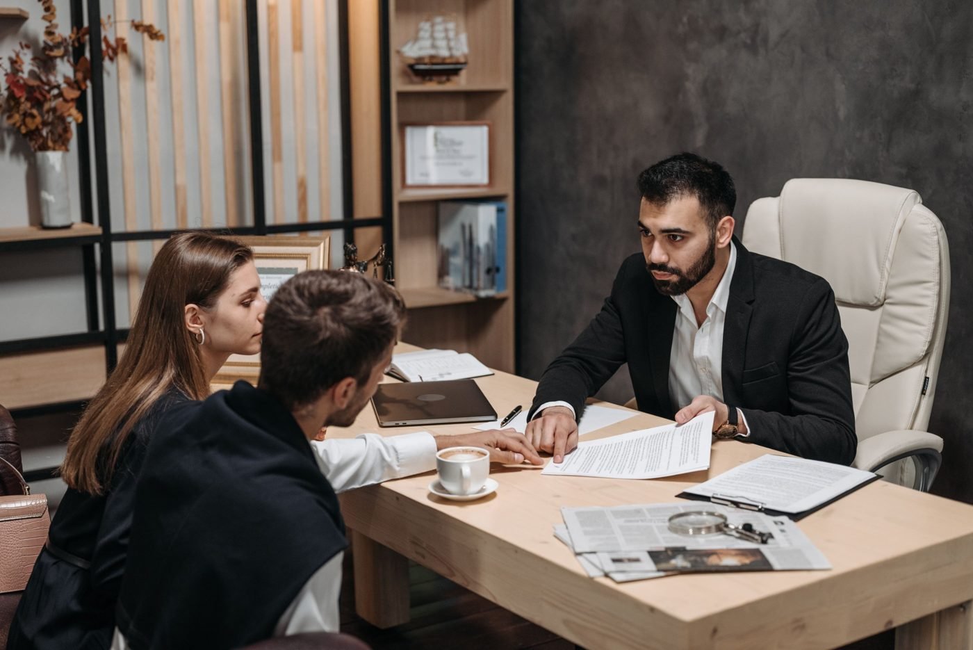 Attorney reviewing legal documents with clients