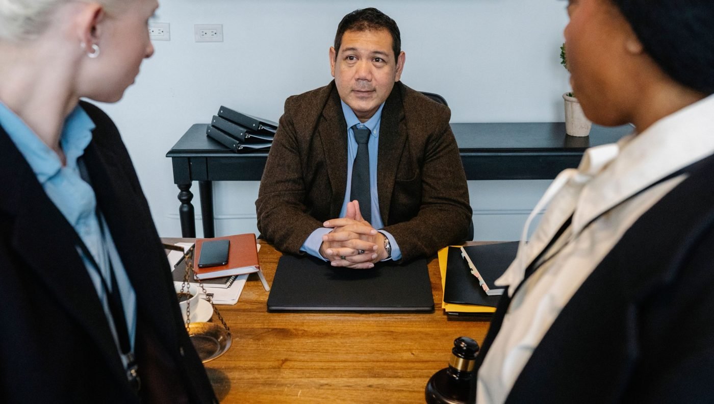 Legal professionals discussing a case in an office