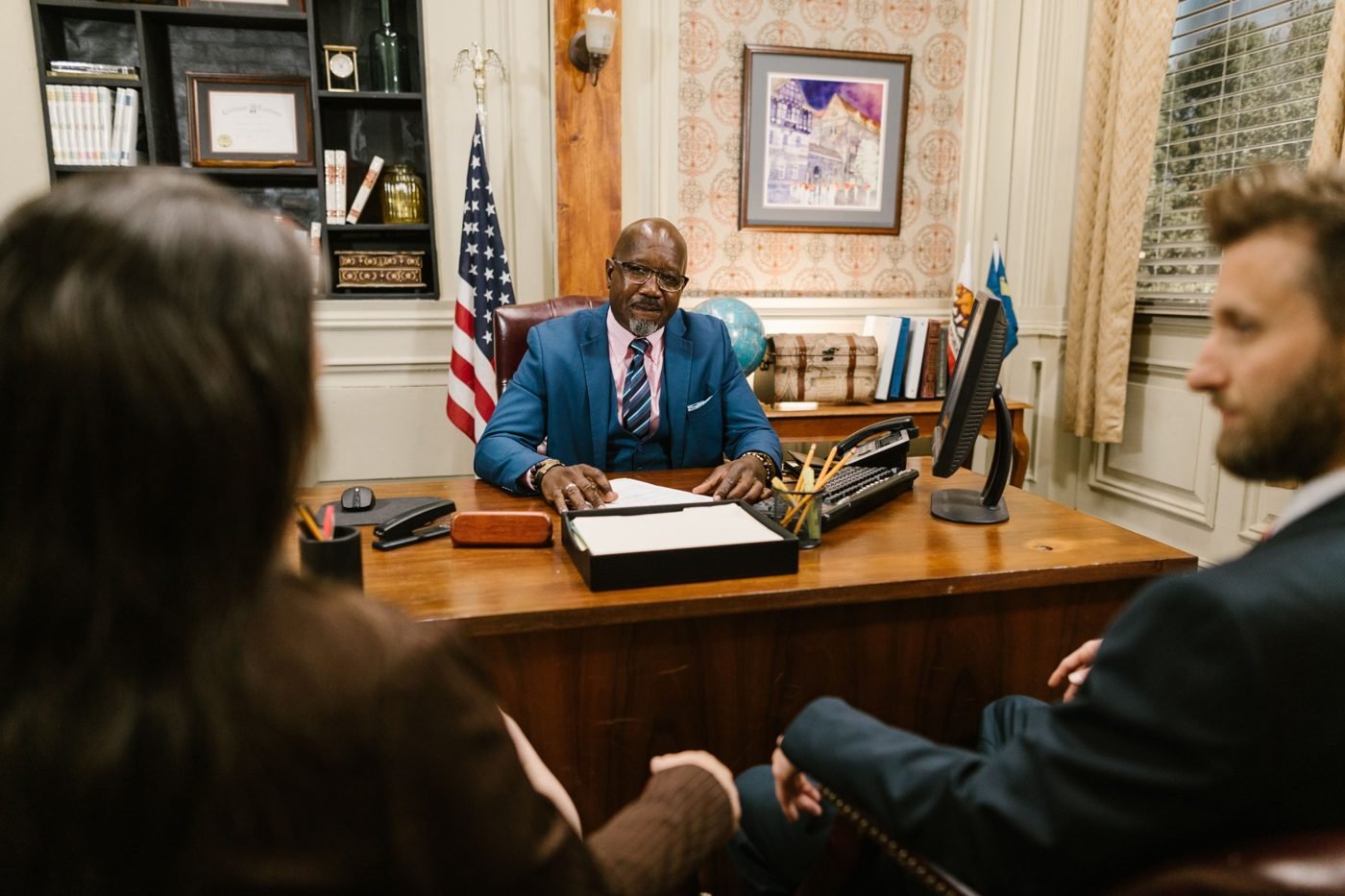 Legal professionals meeting with clients in a professional office